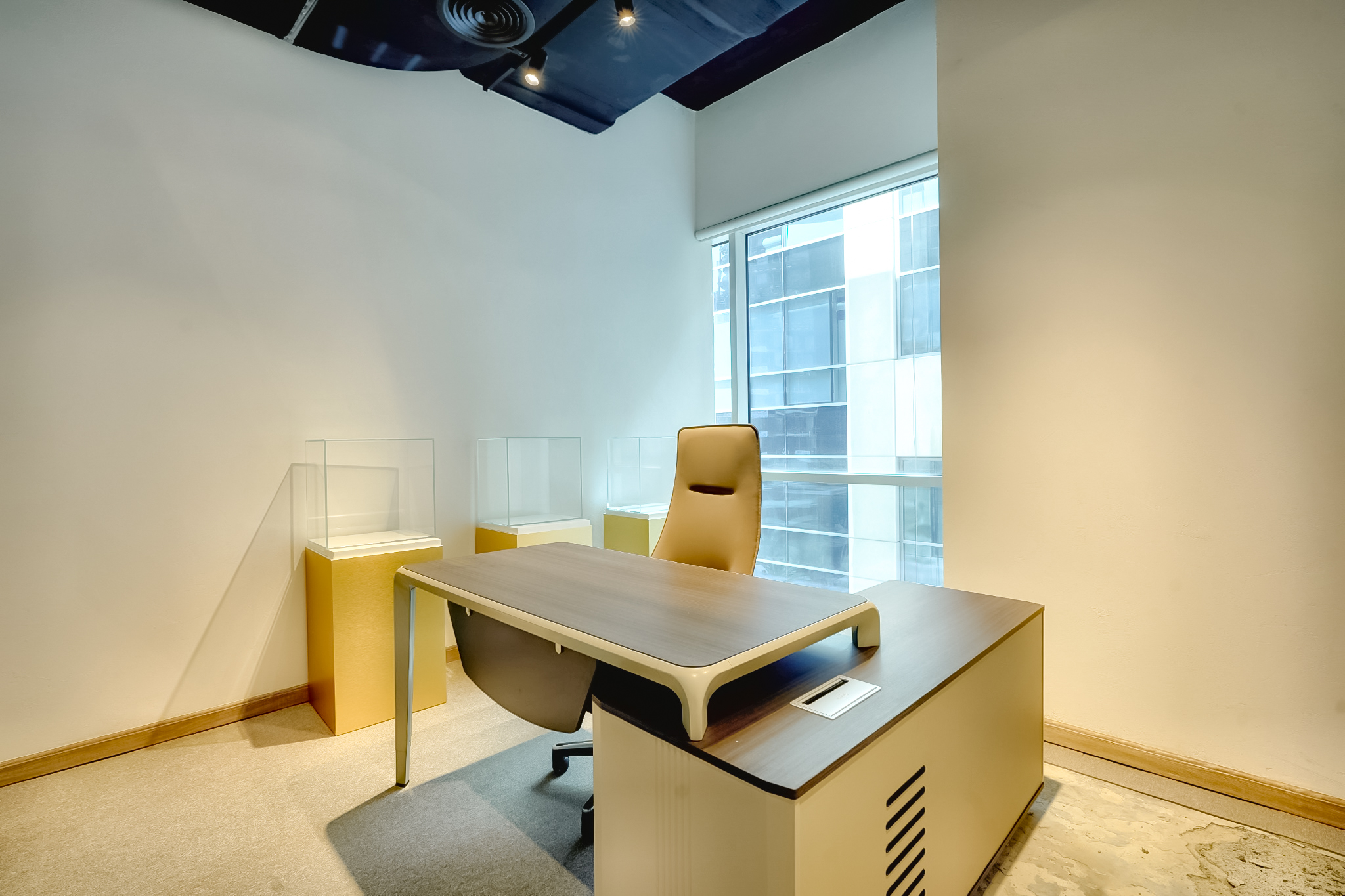 Private office with gold display vitrines