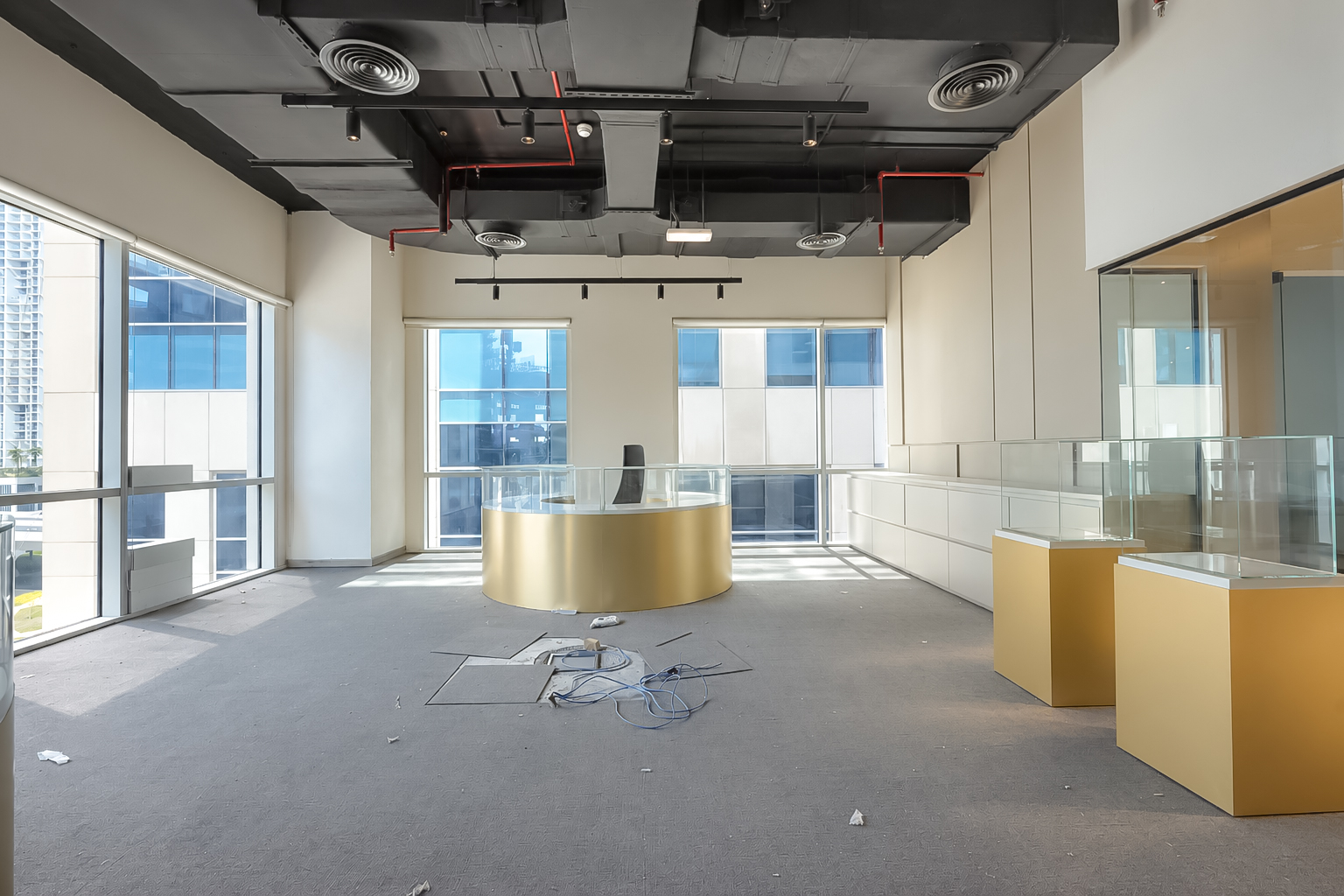 Showroom with gold counter and floor-to-ceiling windows